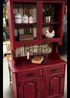 a red hutch with baskets on it and the words, awesome in your dining area write a comment