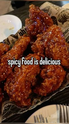 a basket filled with fried food sitting on top of a table