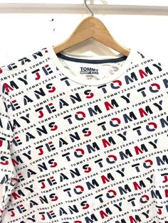 "Vintage Tommy jeans top S/p 19\" underarm to underarm  24\" long 100% cotton See all photos for best description" Affordable Tommy Hilfiger Logo Print T-shirt, Trendy Cotton Tops With All Over Print, Trendy Cotton T-shirt With All Over Print, Trendy Short Sleeve Tops With All Over Print, Cotton Top With Logo Print For Spring, Cotton Tops With Logo Print For Spring, Spring Cotton Top With Logo Print, Cotton Spring Top With Logo Print, Spring Cotton Tops With All Over Print