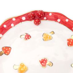 a red and white plate topped with lots of hearts on top of polka dot trim