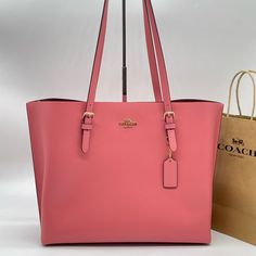 Brand New With Tag Coach Leather Mollie Shoulder Tote Bag Pebble Leather Color: Taffy Inside Multifunction Pocket Zip-Top Closure, Fabric Lining Handles With 10 1/4" Drop Side Open Compartments 13 1/4" (L) X 11" (H) X 5" (W) Elegant Large Capacity Pink Shoulder Bag, Elegant Pink Shoulder Bag With Large Capacity, Luxury Large Capacity Pink Shoulder Bag, Pink Large Capacity Leather Bag, Large Capacity Pink Leather Bag, Feminine Pink Bag For On-the-go, Feminine Bags With Branded Hardware, Pink Tote Shoulder Bag With Dust Bag, Elegant Pink Bags For Daily Use