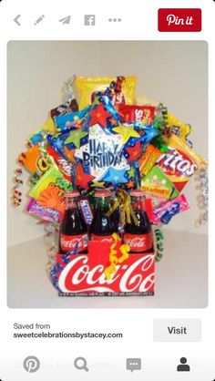 a birthday gift basket filled with soda and candy