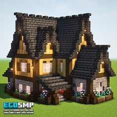 two small houses made out of blocks in the grass