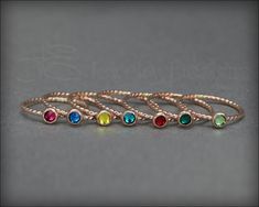 This beautiful dainty ring is made from 14k gold-filled and features a small 4mm Swarovski Crystal or Synthetic Opal that has been set in a bezel setting. The band has a beautiful twist pattern. It can be worn alone or with my other stacking rings. • sold individually• 14k gold-filled, synthetic opal, Swarovski crystal• birthstone/opal: 4mm• band width: 1.3mm Don't know your ring size? Purchase a Reusable Ring Sizer *This is a made to order item. Please check the announcement at the top of the p Stackable Birthstone Rings, Opal Stacking Ring, Sterling Silver Opal Ring, Birthstone Ring Mothers, Birthstone Stacking Rings, Silver Opal Ring, Twist Pattern, Sterling Silver Stacking Rings, Synthetic Opal