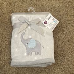 a baby blanket with an elephant on it