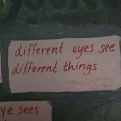 two signs on the wall that say different eyes see different things