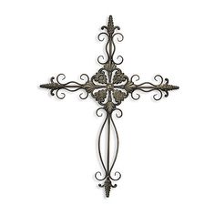 a metal cross with intricate designs on it