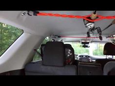 the inside of a vehicle with various items hanging from it's ceiling and lights on