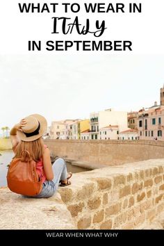 a woman sitting on the edge of a stone wall with text overlay that reads what to wear in italy in september