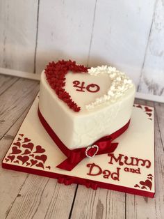 a heart shaped cake with the number forty on it