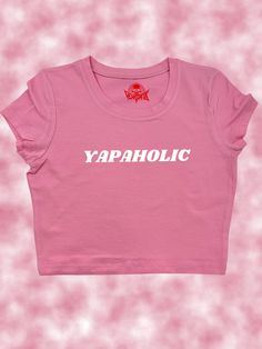 Yapaholic Crop Top- Snug Fit Step into the limelight with the Yapaholic Crop Top, the ultimate fashion statement for the woman who never runs out of things to say. Perfect for the conversationalist who can chat about anything from A to Z, this crop top is designed for those who blend humor with a lively spirit.  Please select the text color and add to personalization (second to last slide)! SIZING Please carefully review sizing charts and product descriptions. Due to lighting, phone screens, or Funny Baby Tees, Funky Shirts, Funny T Shirt Sayings, Y2k Crop Top, Crop Top Designs, Baby Crop Top, Cute Crop Top