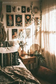 a bedroom with lots of pictures on the wall