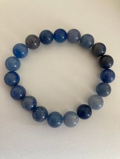 This handmade bracelet is made using gemstones 10mm beads in diameter. The beads are natural crystals and may vary n shape and colour. Blue Aventurine is a gentle stone that resonates from the mind to the heart, working calmly, rationally, and steadily. It enhances the masculine energy, and is a stone of self-discipline and inner strength. Blue Aventurine Crystal, Blue Aventurine, Aventurine Crystal, Masculine Energy, Self Discipline, Handmade Bracelet, Inner Strength, Crystal Bracelet, Crystal Bracelets