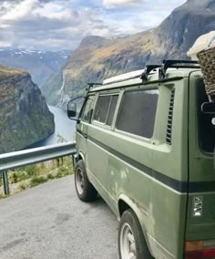 a van parked on the side of a mountain road