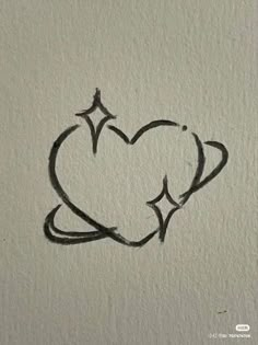 a heart drawn on the wall with black ink