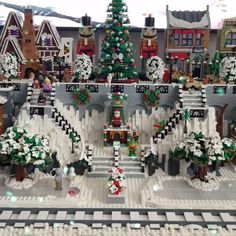 a lego christmas village with trees and decorations