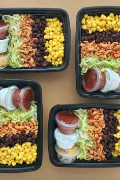 two trays filled with different types of food and condiments next to each other