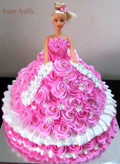 a cake made to look like a barbie doll