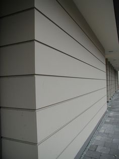 the side of a building with white siding