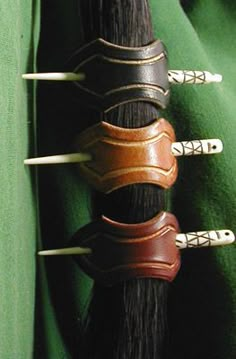 three different types of hair on top of each other in front of a green cloth