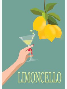 a hand holding a martini glass with lemons hanging from the tree in front of it