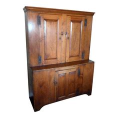 an old wooden cabinet with two doors