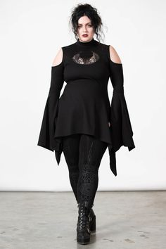 MOONSHINE.- Soft, super stretch fabric.- Statement crescent moon lace cut-out.- Cold shoulder.- High neck.- Hanky hem.- Long line.- Button closure.Model is 5ft 5 and wears a size L.with KILLSTAR branding, 60% Rayon, 35% Nylon, 5% Elastane. Plus Size Rogue Cosplay, Soft Goth Outfits Plus Size, Whimsical Goth Fashion Plus Size, Casual Romantic Goth, Adult Goth Fashion, Plus Size Witch Fashion, Plus Size Gothic Fashion, Goth Outfits Plus Size, Alternative Outfits Plus Size