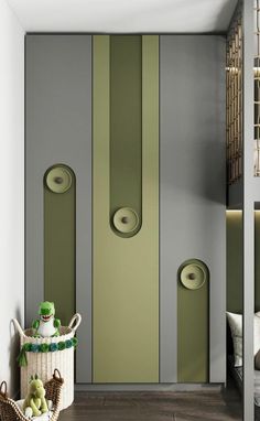 a green and grey striped wall in a room with two speakers on each side of the door