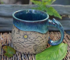 a ceramic mug sitting on top of a bamboo mat