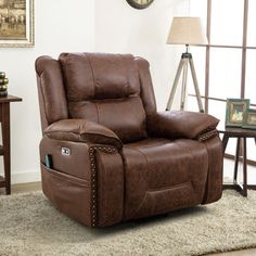 a brown recliner sitting on top of a rug in a living room next to a clock