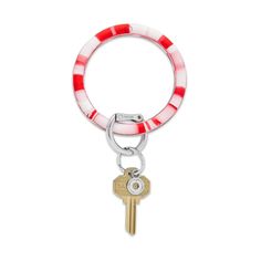 a red and white striped keychain with two keys