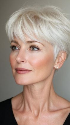 A pixie hairstyle is the ultimate option for women over 50 looking for a fresh, chic look. This short cut enhances your facial features and offers a stylish yet low-maintenance option. Whether you opt for a sleek, smooth finish or a more textured, edgy style, the pixie is always a hit. Grey Pixie Haircut Older Women, Haircut Pixie, Too Cute To Handle, Short Pixie Bob, Flattering Hairstyles, Short Silver Hair, Classic Bob, Hairstyles For Women Over 50