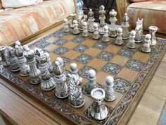 a chess set is sitting on a coffee table