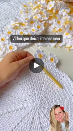 the video shows how to crochet daisy doily