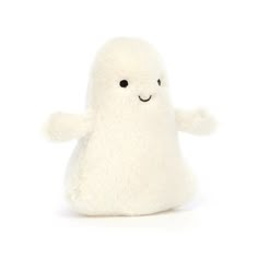 a white stuffed animal with black eyes and arms, sitting on a white surface in front of a white background