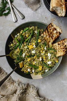 a bowl filled with rice, green beans and corn