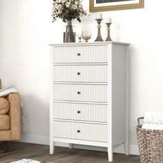 a white chest of drawers in a living room