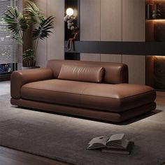 a brown leather couch sitting on top of a rug