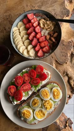 two plates filled with food on top of a wooden table