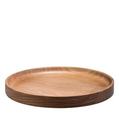 a round wooden tray on a white background