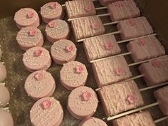 there are many pink cakes that are on the trays and ready to be eaten