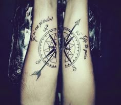 two people with compass tattoos on their legs