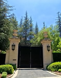 an entrance to a home with two gates