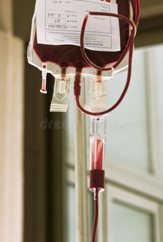 an iv tube with blood in it is attached to a medical device royalty images and stock photography