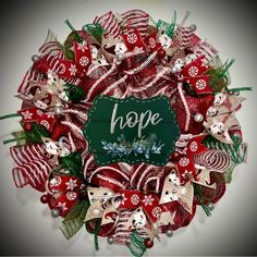 a christmas wreath with the word hope written on it