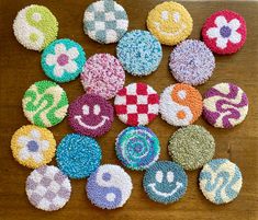 several decorated cookies sitting on top of a wooden table