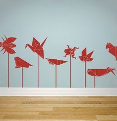 a wall with some red birds on it