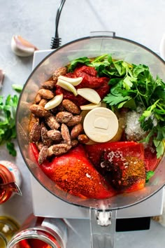 ingredients in a food processor ready to be blended into soups and sauces for dinner