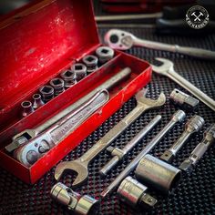 a tool box with wrenches and other tools in it