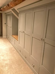 an empty room with built - in cabinets and carpeted flooring on the walls